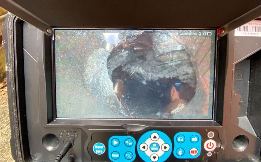 Drain camera monitor showing a broken section of sewer pipe 5.95 metres from the access point
