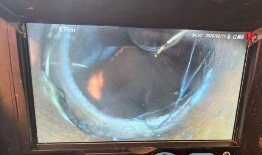 Drain camera monitor showing tree roots inside a sewer pipe 6.79 metres in
