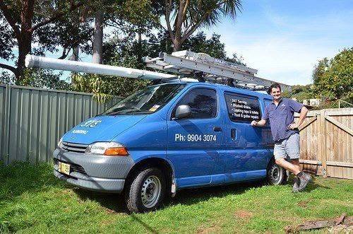 Simon Totterdell standing beside the first STS Plumbing van, a blue signwritten van