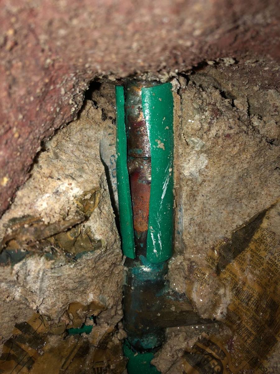 New lagged copper pipe in place in the opened wall before it is closed up
