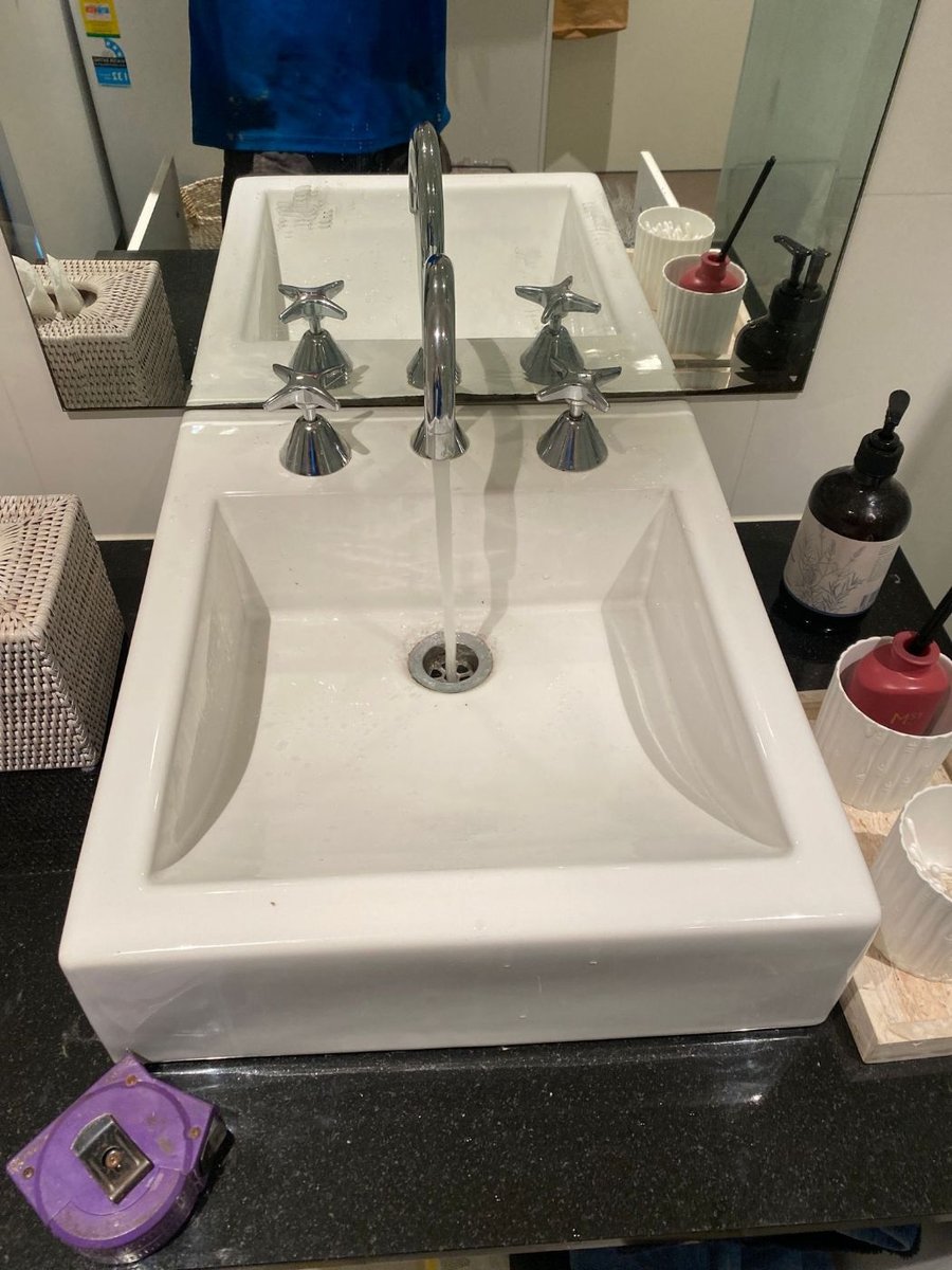 White basin with serviced taps and new tap tops