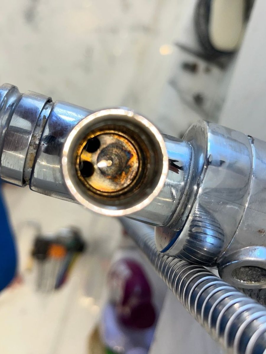 Shower mixer body opened up with the cartridge seat showing
